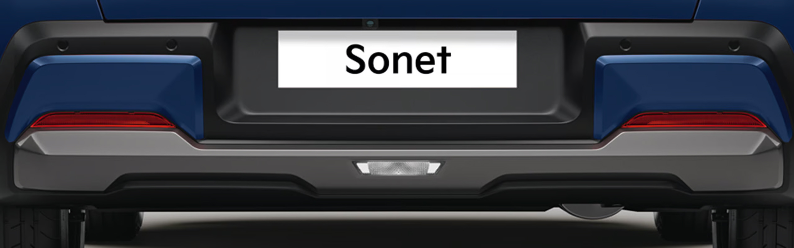 Sporty Aerodynamic Rear Skid Plates with Dark Metallic Accents